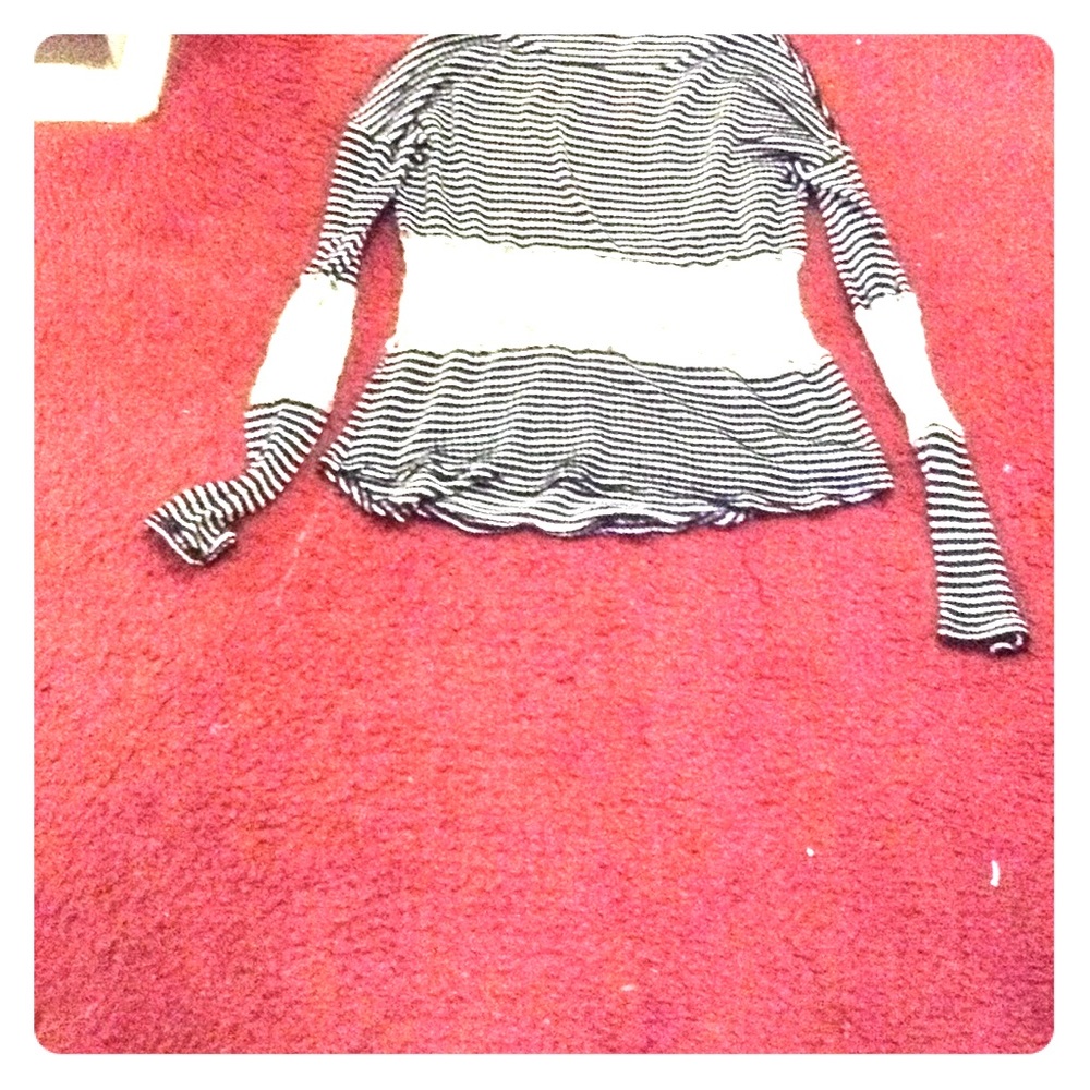 A see through black and white striped shirt.